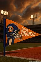 Full view of orange pennant standing on field showing helmet logo and text