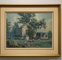 Front view of framed textured print showing stone house scene and matting