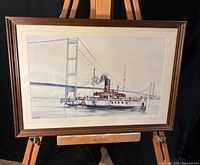 Full view of framed maritime artwork on easel