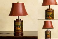 Full view of lamp on table, showing equestrian canister body, column, finial, and shade (shade excluded from lot)