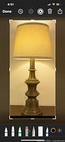 Front view of brass Stiffel lamp with shade shown for display