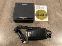 Shaver, coiled cord with 12V plug, closed case, manual