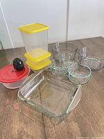 All glass and plastic kitchenware items arranged on table