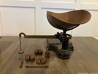 Overall view of balance scale with bowl, platform, beam and loose weights