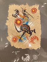 Close-up of artwork showing textures, motifs, signature