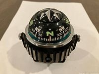 Front view showing dome, markings, adjustment screws