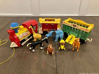 Entire train set with three cars and six animals displayed