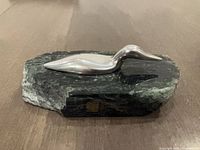 Full view of aluminum loon on marble base