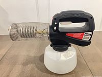 Right side view of fogger showing mesh barrel and tank