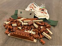 Pile of Minibrix bricks, roof panels, wall panel, manuals