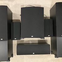 Front view of complete six-speaker set: two towers, two bookshelves, centre channel and subwoofer