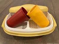 Steamer assembled with insert and two tumblers displayed on top