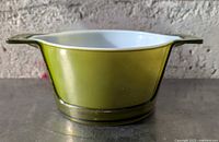 Side view of olive green Pyrex 473 casserole