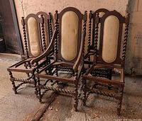 Front view of six barley twist chairs showing frames, upholstery and missing seats