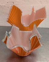 Two orange/white pinstripe handkerchief vases stacked