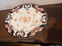 Full view of Imari platter on wood surface