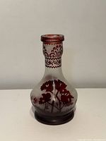 Front view of cameo glass vase showing landscape cut design