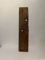 Full view of carved wood plaque front