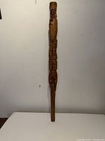 Full length view of carved talking stick