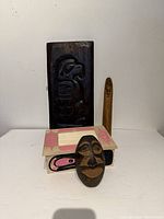 All five wooden Native style items displayed together