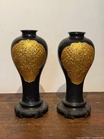 Front view of both vases on stands