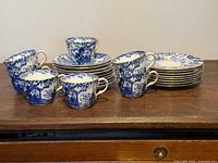 Full set of teacups, saucers and dessert plates stacked