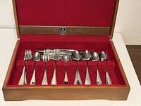 Open flatware box showing full set arranged