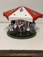 Full view of carousel showing roof and horses