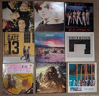 All nine record jackets front view in 3×3 grid