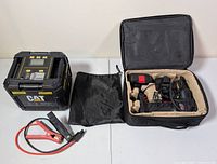 CAT Power Cube, booster cables, drawstring bag, Air Hawk inflator kit opened