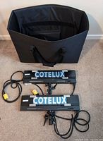 Two Cotelux fixtures and carry case Overview