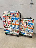 Front view of both Canada print suitcases
