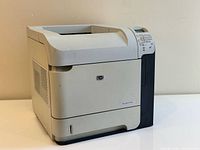 Left-front view of HP LaserJet P4015N printer showing exterior condition