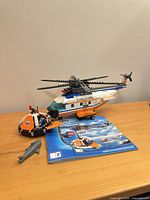 Helicopter, liferaft, two manuals, shark
