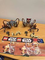 Overview of both assembled sets with manuals and minifigures