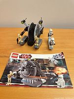 Assembled tank droid, four minifigures, instruction booklet