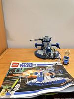 Assembled AAT, speeder, Yoda and Clone Trooper, instruction manual foreground