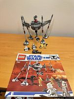 Full set assembled with instruction booklet and minifigures displayed