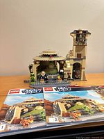 Full view of assembled palace, tower, minifigures and both manuals