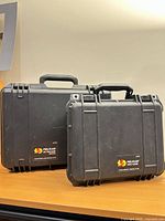 Front view of both Pelican cases standing side by side