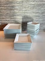 Stacked set showing all dinner plates, salad plates and bowls