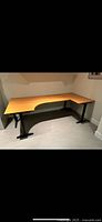 Desk front view showing L shape and steel legs
