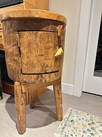Full view of side table showing legs, door, overall wear