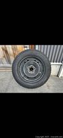 Full side view of one Yokohama tire mounted on steel rim