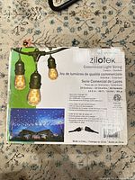 Front of box showing Zilotek commercial light string details and product image