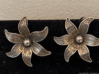 Front view of both sterling floral earrings on display card