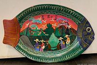 Top view of fish-shaped hand painted plate showing full artwork