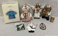 Group shot of all nurse and medical-themed ornaments and figurines