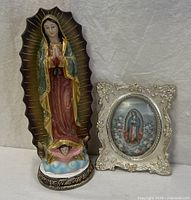 Statue and framed print together