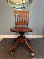 Front view of wooden banker’s swivel chair